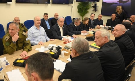 Benjamin Netanyahu sits in the middle at one side of the cabinet table, surrounded by other officials