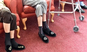 Residents feet and zimmer frame in a care home.