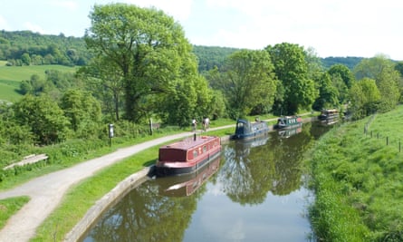 Boats lined up alongside the Avon and Kennet Canal in the village of Claverton