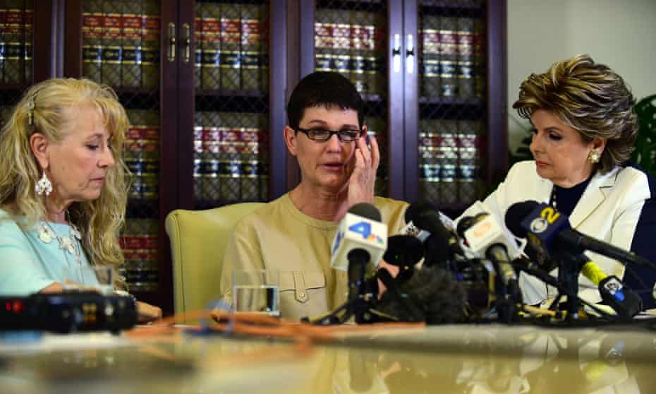 Beth Ferrier reacts while speaking seated between attorney Gloria Allred and Rebecca Lynn Neal, left.