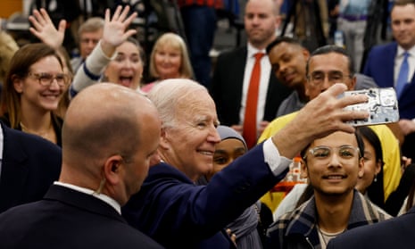 Joe Biden takes a selfie with attendees during an event on Chips manufacturing, at Onondaga Community College in Syracuse, New York, last week.