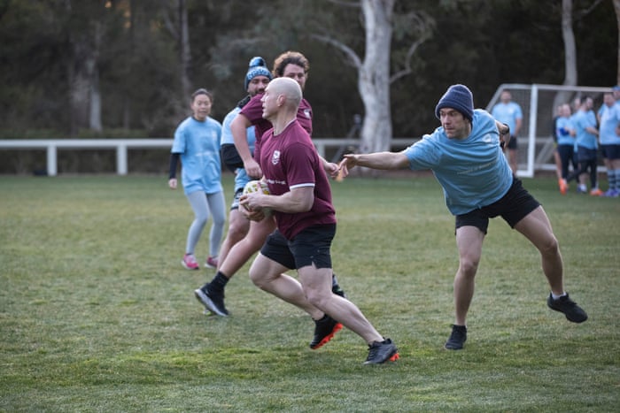 ACT senator David Pocock evades a tackle