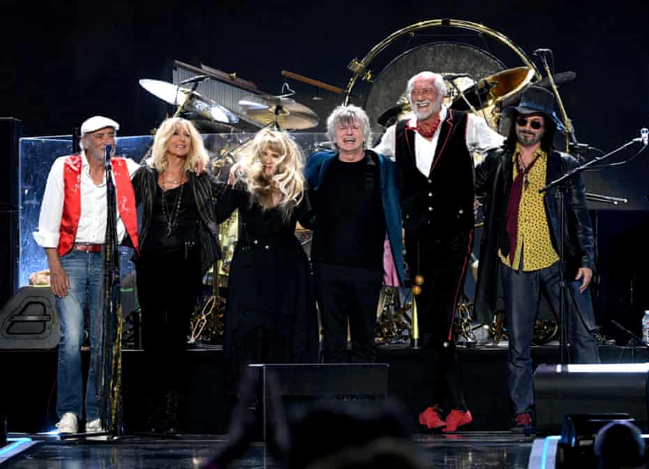 Neil Finn (centre right) flanked by John McVie, Christine McVie, Stevie Nicks, Mick Fleetwood, and Mike Campbell of Fleetwood Mac.