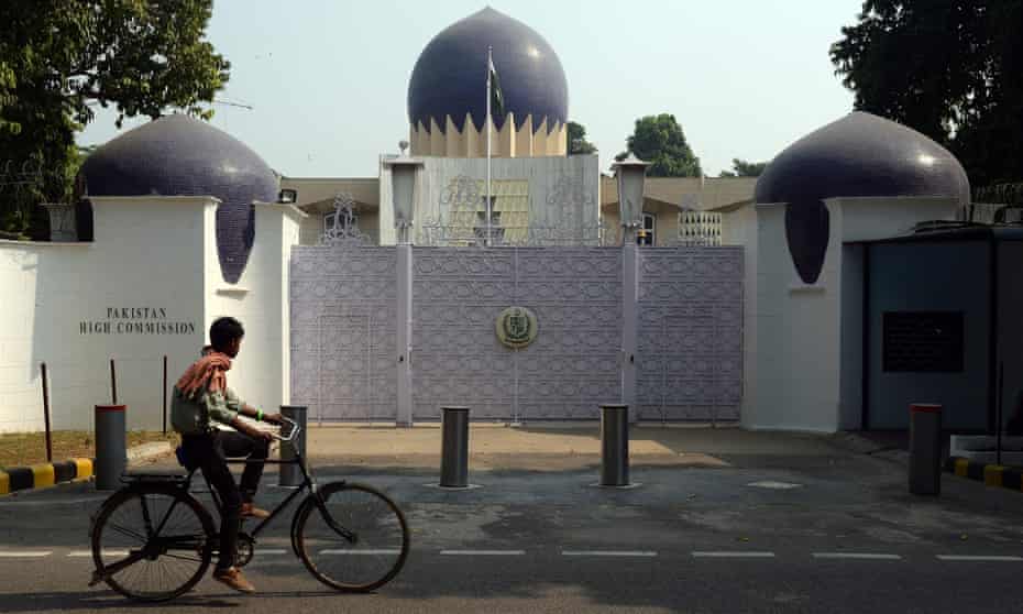 An Indian cyclist rides past the entrance to the Pakistan high commission in New Delhi.