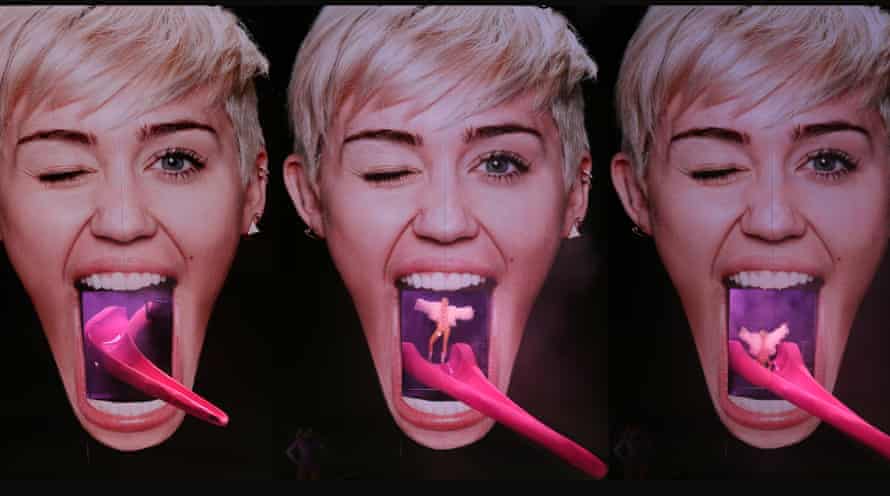Miley Cyrus emerges from her own mouth, as designed by Devlin, on her 2014 tour.