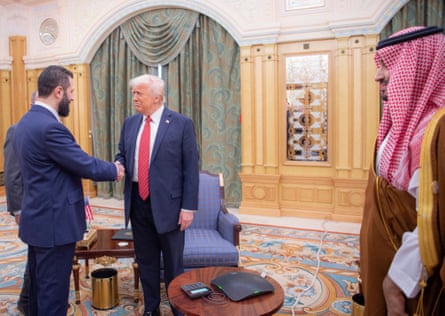 Ahmed al-Sharaa shakes hands with Donald Trump