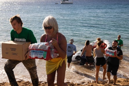 Volunteers unload supplies to Maui towns affected by the wildfires.