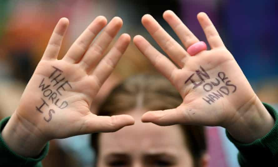 A school students takes part in a protest in Sydney, Friday, May 21, 2021. Students across the country are striking in the name of climate action, calling on the federal government to stop using taxpayer money for fossil fuels. (AAP Image/Joel Carrett) NO ARCHIVING