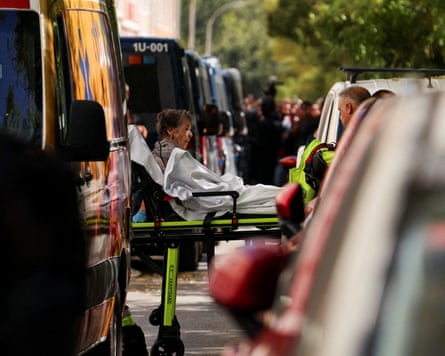 Maricarmen Abascal, 87, is transported on a stretcher to an ambulance after being evicted from her apartment in Spain, 23 September 2026.