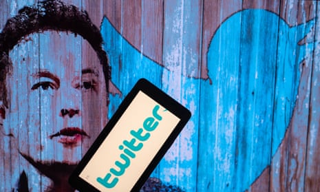 Elon Musk's Twitter account displayed on a mobile with Elon Musk in the background are seen in this illustration.