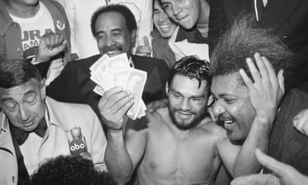 Roberto Durán, seen here collecting his bonus from Don King after defeating Sugar Ray Leonard, says he always insists on being paid in cash.