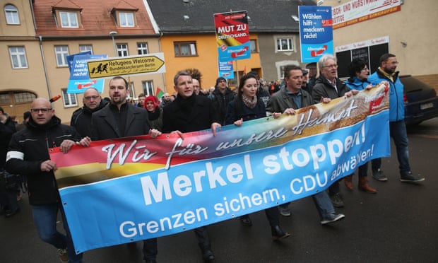 AfD supporters in Raguhn, Germany, march against Angela Merkel’s refugee policy