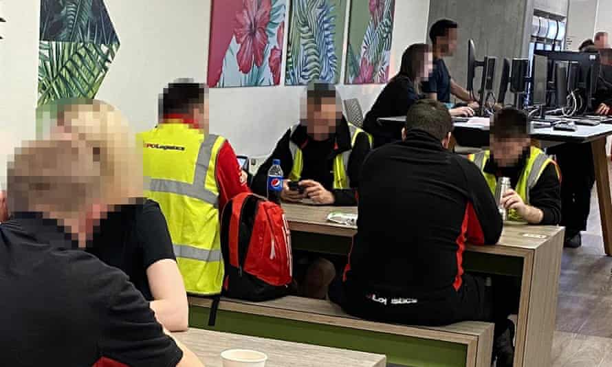 Staff sitting side by side in the Asos canteen.