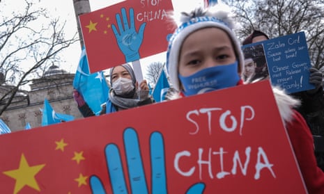 Uyghur protesters who have not heard from their families living in East Turkestan hold placards and flags during a protest last month against China, in Istanbul, Turkey.