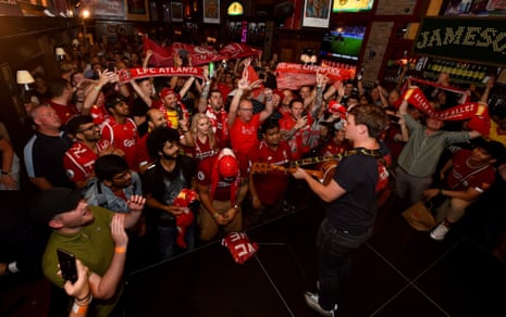 Jamie Webster entertains Liverpool fans at Carragher’s pub in New York City.