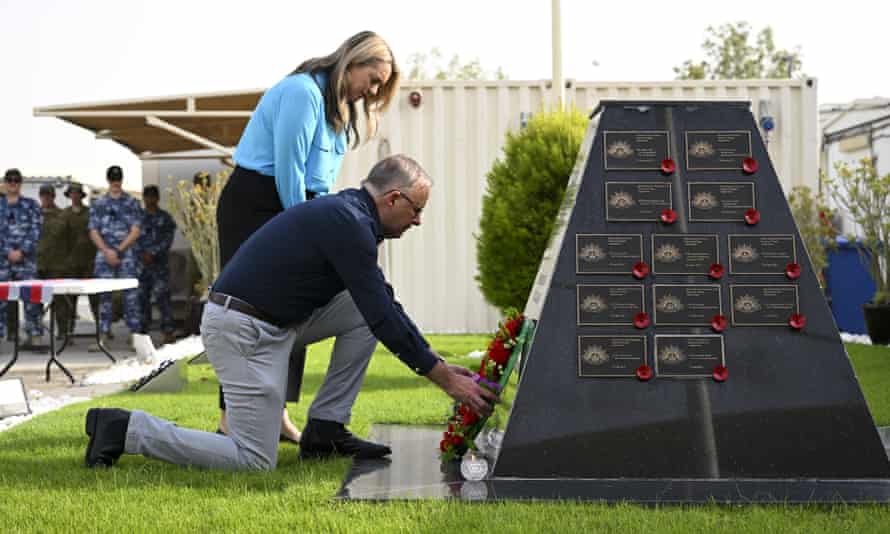 Prime minister Anthony Albanese and his partner Jodie Haydon lay a wreath at a memorial at Camp Baird.