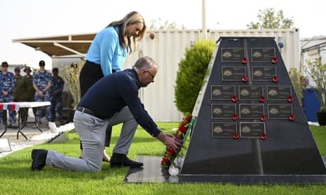 Prime minister Anthony Albanese and his partner Jodie Haydon lay a wreath at a memorial at Camp Baird.