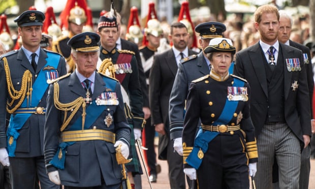 King Charles and Princess Anne, in front, with the Prince of Wales and Prince Harry behind, during the procession on The Mall in London