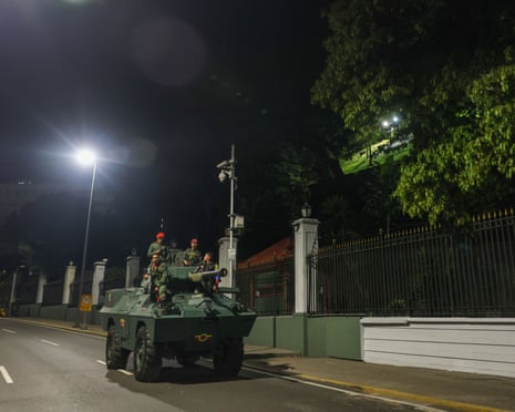 Military personnel guard the perimeter of the Miraflores presidential palace in Caracas, Venezuela, on Saturday.