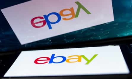 The eBay logo on a smartphone.