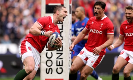 George North of Wales celebrates scoring their side's first try with teammates.