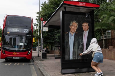 An activist put up a poster showing Donald Trump and Jeffrey Epstein near the United States embassy in London on Thursday.