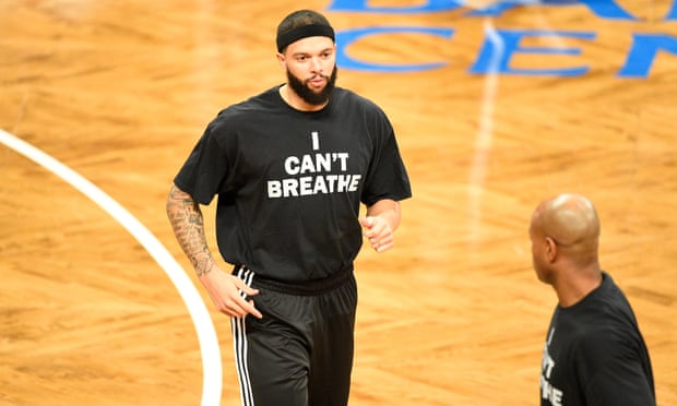 Clear signals: Brooklyn Nets guard Deron Williams wears a T-shirt to honour Eric Garner during warmups before a NBA game between the Cleveland Cavaliers and the Brooklyn Nets.