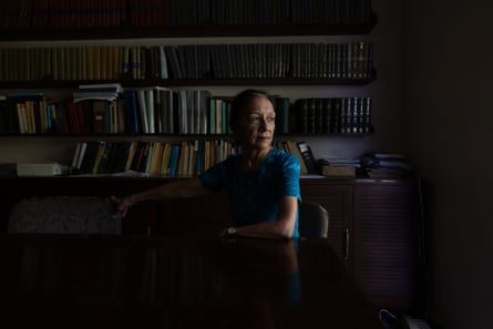 Opposition leader Tina Browne sitting with book shelves behind her