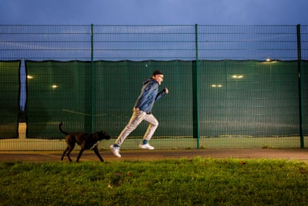 Tim running with his dog tailing him