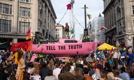 Extinction Rebellion protesters place a sailing boat in the middle of the intersection at Oxford Circus, London in 2019.