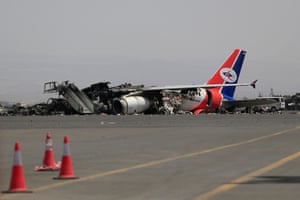 A destroyed airplane lies on the tarmac at Sana’a international airport