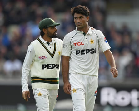 The Pakistan captain Babar Azam puts his hand on the shoulder of his fast bowler Razaullah while discussing tactics during the first day of the third Test against England at Edgbaston.