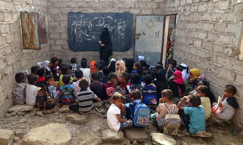 Displaced Yemeni children attend school in a derelict building, in the war-torn western province of Hodeidah.
