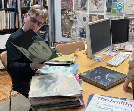 Andy Rourke of the Smiths at ARC looking at Smiths LPs he’s never seen