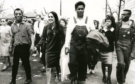 Baez marching with James Baldwin and James Forman, from the documentary Joan Baez I Am a Noise.