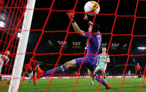 Stade Rennes’ Ismaila Sarr scores their third goal past Arsenal’s Petr Cech.