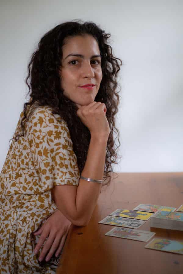 Jessica Dore sits for a representation astatine her home.