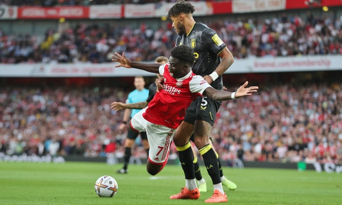 Arsenal v Aston Villa, Manchester City v Nottingham Forest and more – live! | Premier League 11 Bukayo Saka of Arsenal pushed by Tyrone Mings of Aston Villa - no penalty given.