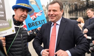 Arron Banks (right) talks to an anti-Brexit campaigner outside the Houses of Parliament.