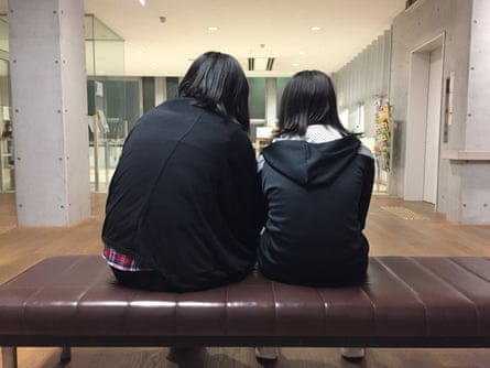Hisako Yoshida and her daughter wait for dinner to be served at a children’s cafeteria in Kawaguchi. Yoshida has struggled to provide for her three teenage children since a cancer diagnosis forced her to quit her job two years ago.