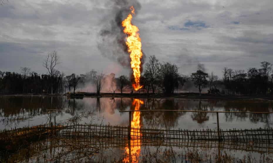 Flames and smoke billow from the Oil India well in Tinsukia, in the north-eastern state of Assam in June.