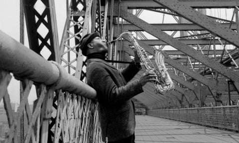 Sonny Rollins plays his saxophone on the Williamsburg Bridge in New York.