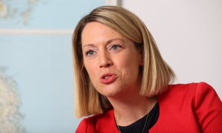 Jenny Gilruth next to a map
