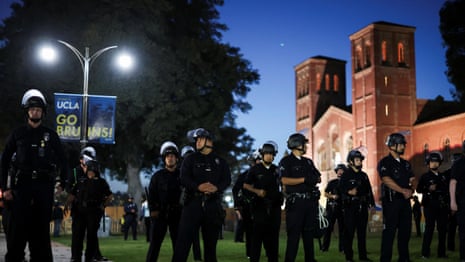 UCLA Gaza protesters in tense standoff with police – video