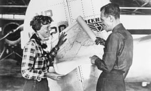 Earhart and Noonan, with a map of the Pacific that shows the planned route of their last flight.