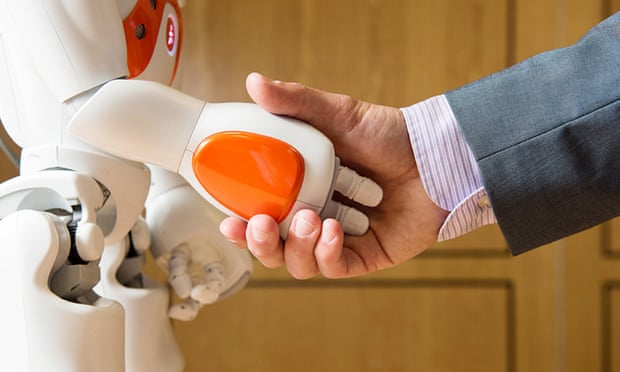 Undated handout photo issued by the University of Bath of a Nao Robot and the hand of a man in a suit