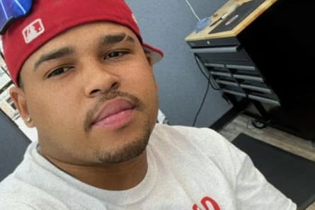 person wearing white shirt and red hat