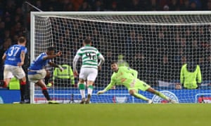 Celtic’s Fraser Forster dives to his right to deny  Alfredo Morelos of Rangers from the penalty spot during the Scottish League Cup final.