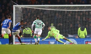 Celtic’s Fraser Forster dives to his right to deny Alfredo Morelos of Rangers from the penalty spot during the Scottish League Cup final.