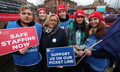 RCN NI director Pat Cullen (centre) joins the picket line outside the Royal Victoria hospital in Belfast.
